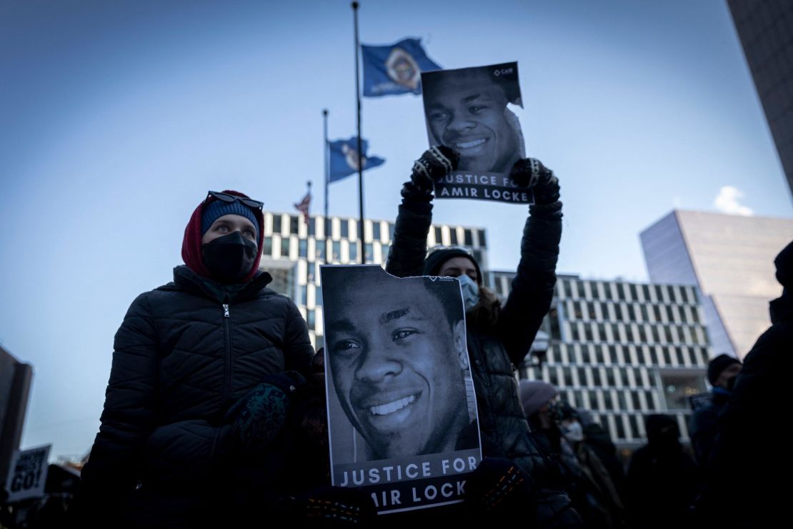 Demonstrators hold photos of Amir Locke during a Minneapolis rally last week. 