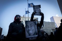 Demonstrators hold photos of Amir Locke during a rally in protest of his killing, outside the Hennepin County Government Center in Minneapolis, Minnesota on February 5, 2022. 