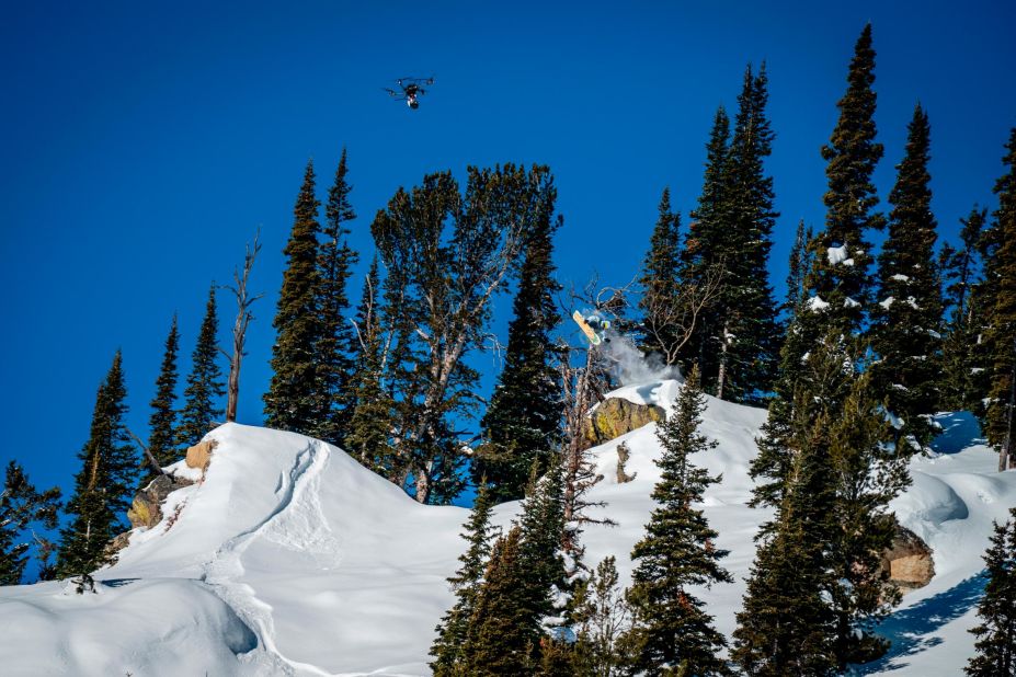 Built by professional drone racer and aerial cinematographer Gabriel Kocher, the drones have eight motors, a customized rotating gimbal, full broadcast system and stabilization platform, and can travel at up to 100 miles per hour. Pictured, Danny Davis and a drone in Jackson Hole.