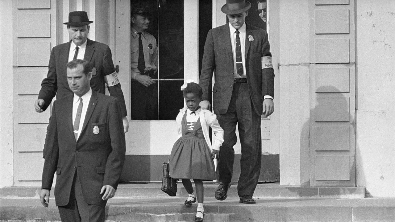 US Deputy Marshals escort 6-year-old Ruby Bridges from William Frantz Elementary School in New Orleans in 1960.