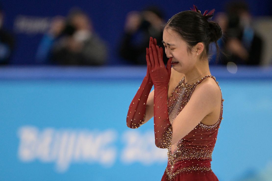 Zhu reacts after competing in the free skate of the figure skating team event at the Winter Olympics.  