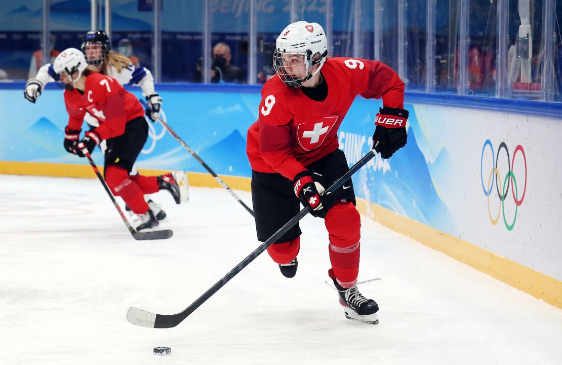 Switzerland's Shannon Sigrist skates with the puck against Finland during the second period of the women's preliminary round group A match at National Indoor Stadium on February 7 in Beijing.