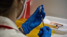 A nurse prepares syringes with the Pfizer coronavirus booster vaccination on January 20, 2022 in Tokyo, Japan. 