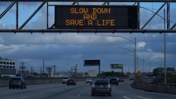 A Caltrans message board with the words "Slow Down. Save a Life" is seen on the Interstate 10 freeway, Friday, Dec. 24, 2021, in Los Angeles. (Kirby Lee via AP)