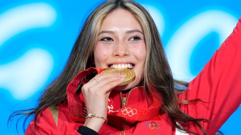 Gold medalist Eileen Gu of China celebrates during the medal ceremony for the women's freestyle skiing big air at the 2022 Winter Olympics.