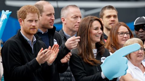 Prince Harry, Prince William and Catherine cheer on runners at the 2017 Virgin Money London Marathon, England.