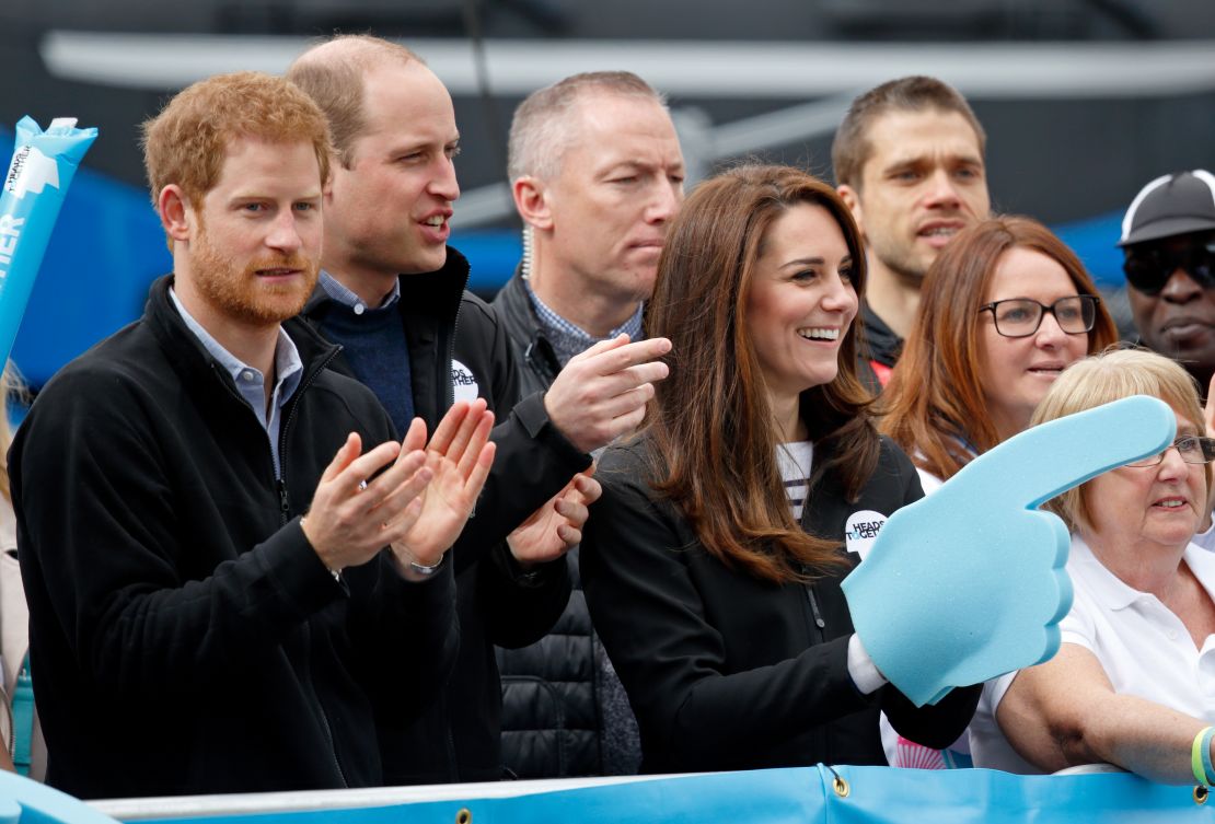 Prince Harry, Prince William and Catherine cheer on runners at the 2017 Virgin Money London Marathon, England.