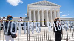 Demonstrators call for Senators to support the elimination of the Senate filibuster in order to pass voting rights legislation and economic relief bills, outside the US Supreme Court on June 23, 2021.