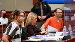Jennifer Crumbley, left, and James Crumbley, right, the parents of Ethan Crumbley, a teenager accused of killing four students in a shooting at Oxford High School, appear in court for a preliminary examination on involuntary manslaughter charges in Rochester Hills, Mich., Tuesday, Feb. 8, 2022. (AP Photo/Paul Sancya)