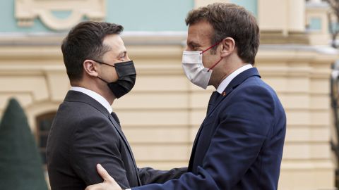 Diplomatic efforts to defuse the tensions around Ukraine continued on Tuesday with Emmanuel Macron, right, arriving in Kyiv for talks with Ukraine's president.