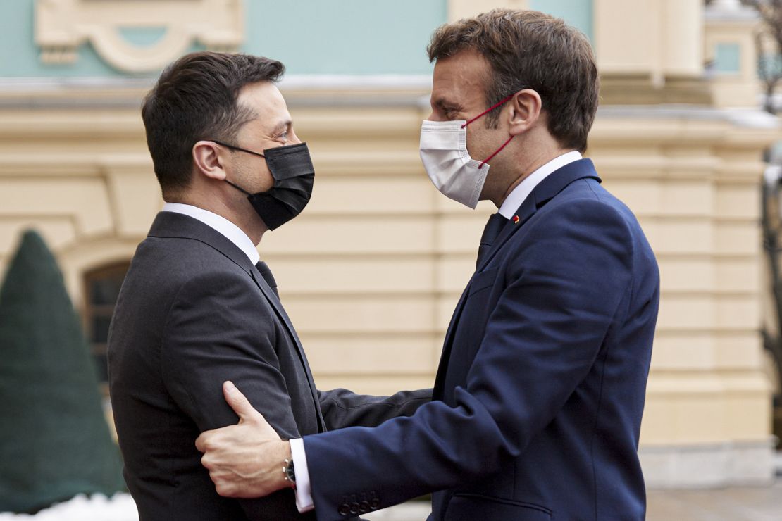 Diplomatic efforts to defuse the tensions around Ukraine continued on Tuesday with Emmanuel Macron, right, arriving in Kyiv for talks with Ukraine's president.