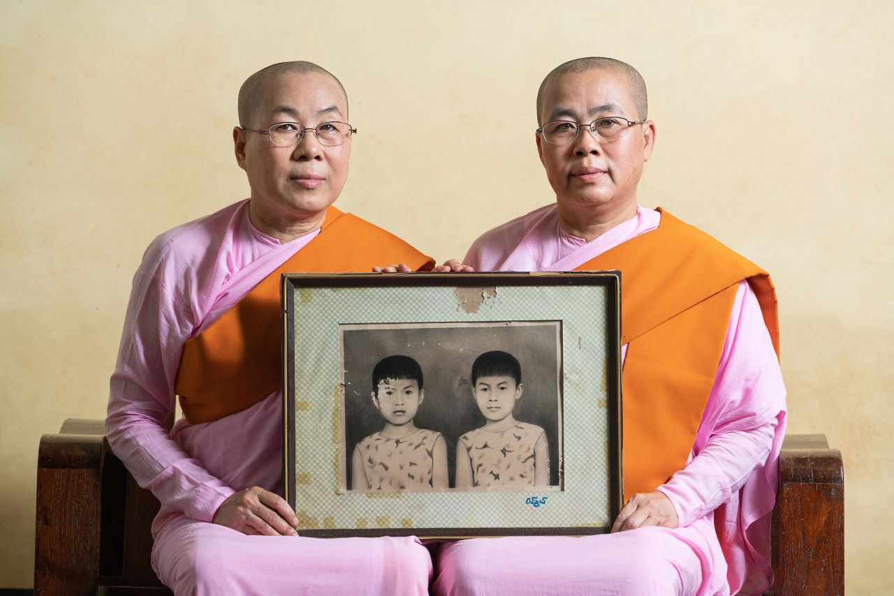 Swe Tun of Myanmar shows a muted portrait of two twin sisters at a Buddhist monastery near the Hpa-an township in "Twin Sisters."