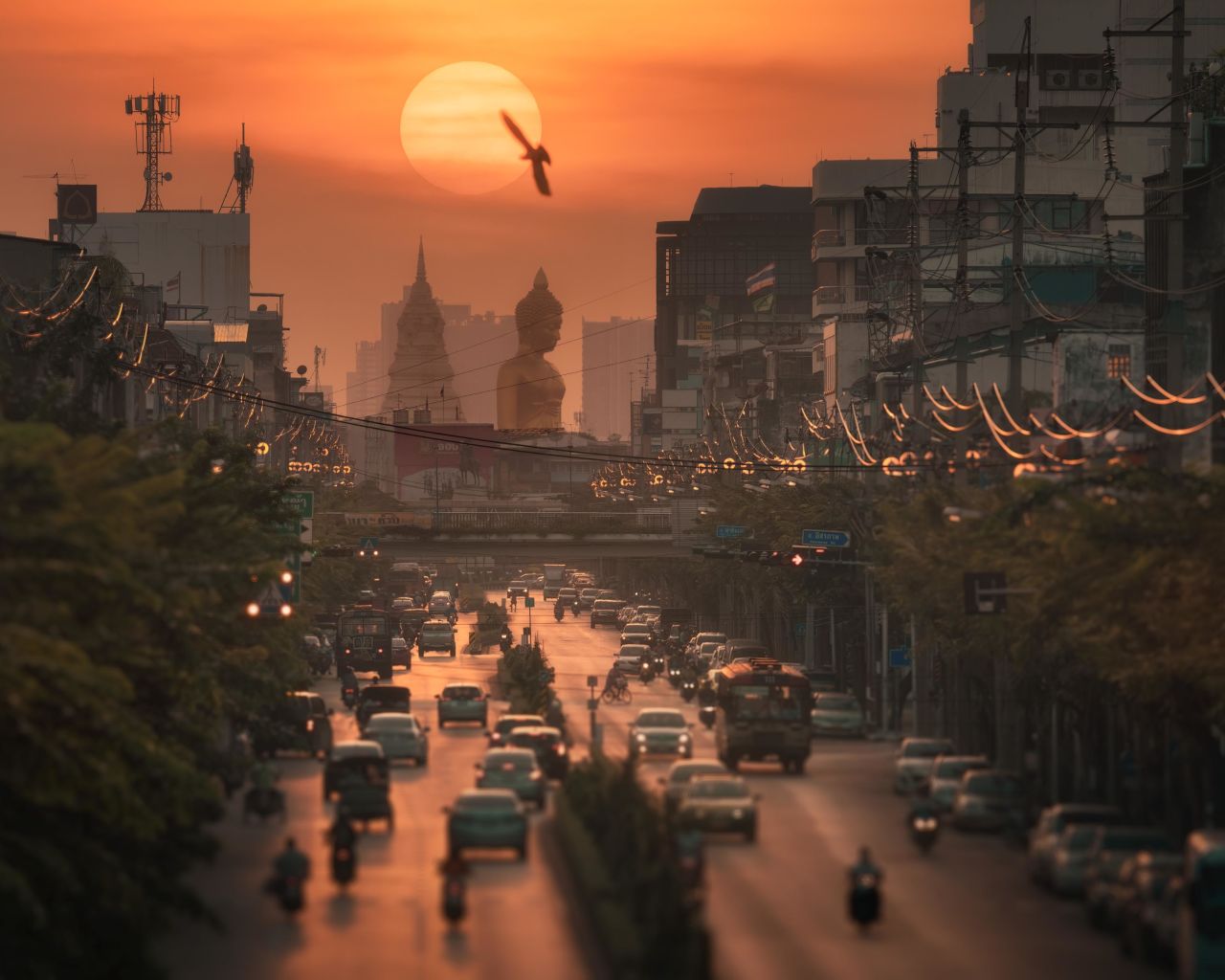 Photographer Kunuch Chutmongkolporn uses the Big Buddha statue in Bangkok, Thailand, as a backdrop for his image "Big Statue in the Middle of the City."