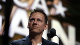 Billionaire tech investor Peter Thiel looks over the podium before the start of the second day session of the Republican National Convention in Cleveland, Tuesday, July 19, 2016. 