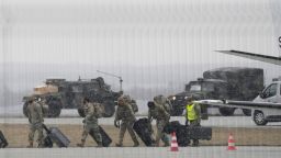 US Army troops of the 82nd Airborne Division unloading vehicles from a transport plane after arriving from Fort Bragg at the Rzeszow-Jasionka airport in southeastern Poland, on Sunday, Feb. 6, 2022. 