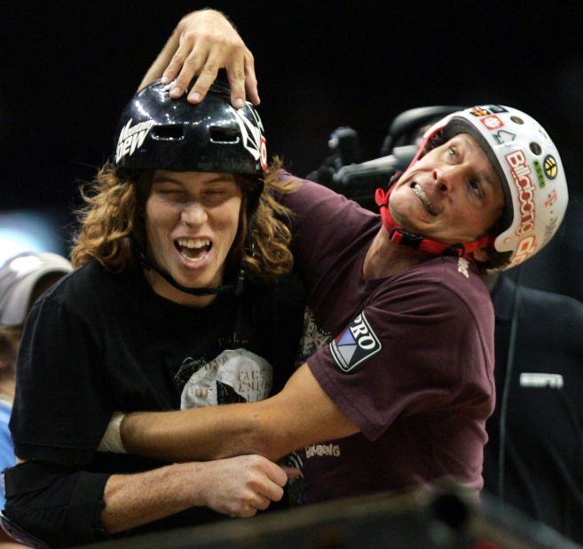 White goofs around with pro skateboarder Bucky Lasek during the X Games in 2004.