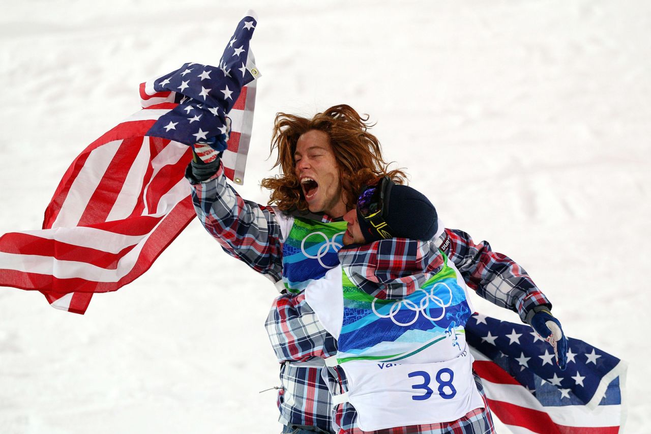White celebrates with fellow American Scott Lago after winning the halfpipe at the 2010 Olympics. Lago took home the bronze.
