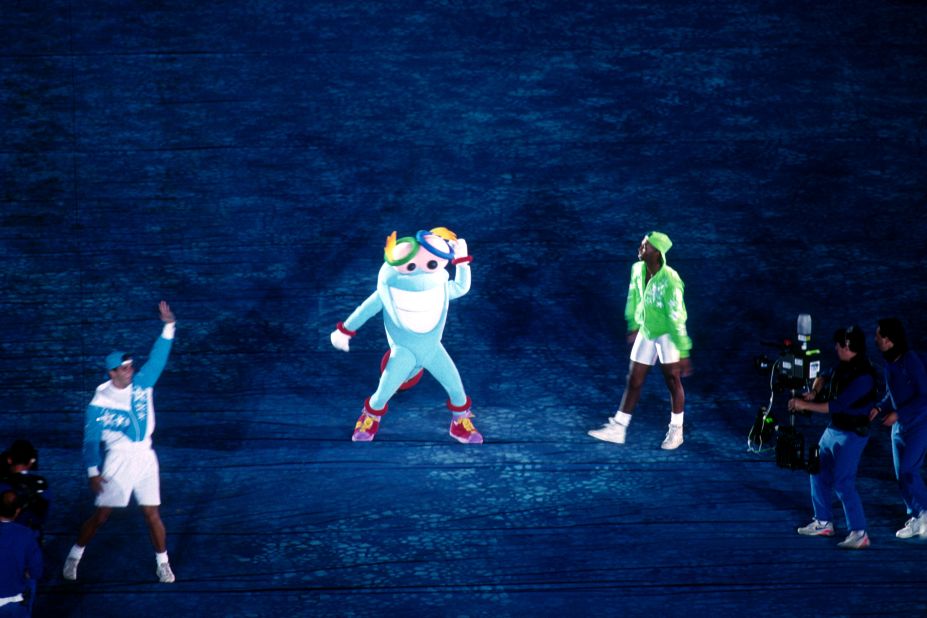 The mascot for the 1996 Atlanta Olympics, Izzy Whatizit, makes his debut appearance on stage.