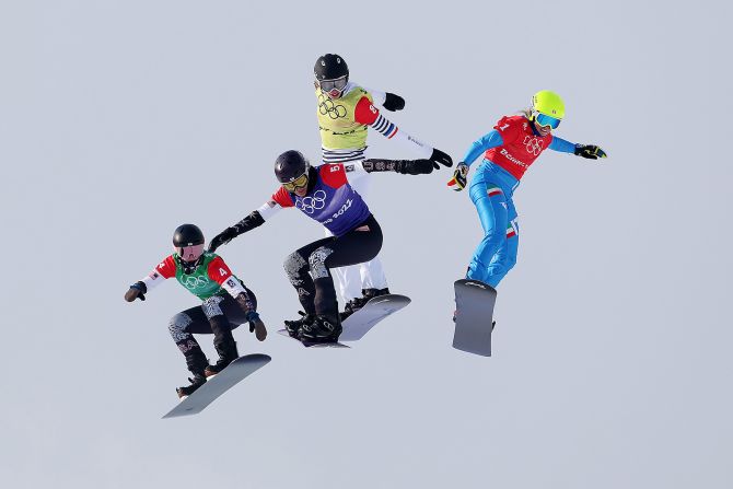 From left, the United States' Stacy Gaskill, the United States' Lindsey Jacobellis, France's Chloe Trespeuch and Italy's Michela Moioli compete in a snowboard cross semifinal on February 9. <a href="index.php?page=&url=https%3A%2F%2Fwww.cnn.com%2Fworld%2Flive-news%2Fbeijing-winter-olympics-02-09-22-spt%2Fh_9fa28ffc70374c24fcb050dd588b6eed" target="_blank">Jacobellis would go on to win the event,</a> her first gold medal in her fifth Olympic Games.