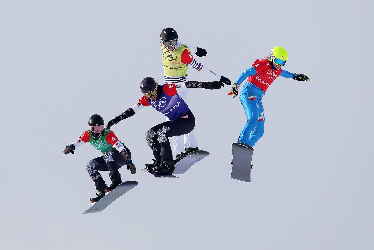 From left, the United States' Stacy Gaskill, the United States' Lindsey Jacobellis, France's Chloe Trespeuch and Italy's Michela Moioli compete in a snowboard cross semifinal on February 9. <a href="https://www.cnn.com/world/live-news/beijing-winter-olympics-02-09-22-spt/h_9fa28ffc70374c24fcb050dd588b6eed" target="_blank">Jacobellis would go on to win the event,</a> her first gold medal in her fifth Olympic Games.