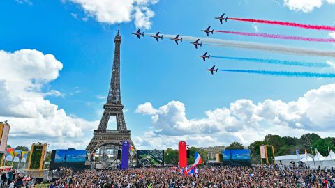 French Elite acrobatic team Patrouille de France flies over the Eiffel Tower during the Olympic Games handover ceremony.