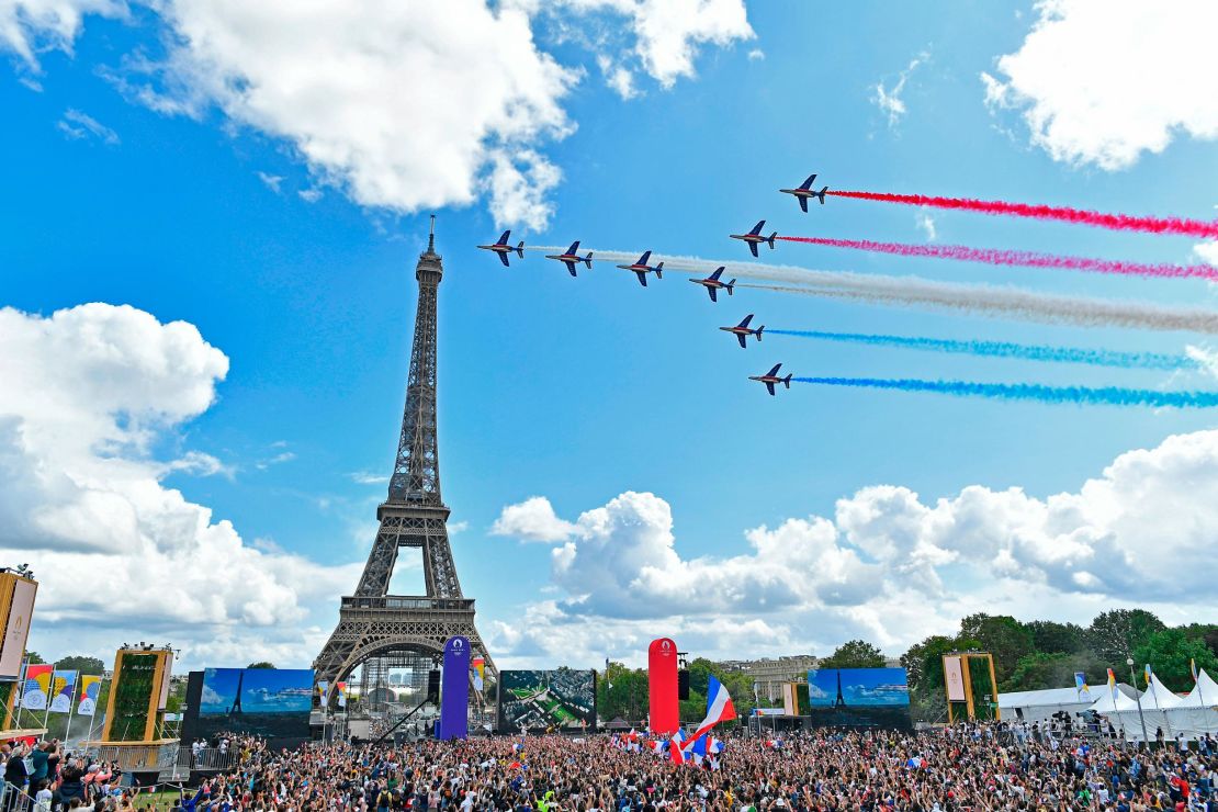 French Elite acrobatic team Patrouille de France flies over the Eiffel Tower during the Olympic Games handover ceremony.