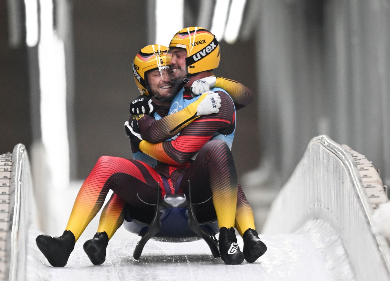 Germany's Tobias Wendl and Tobias Arlt celebrate after winning gold in doubles luge on February 9. <a href="https://www.cnn.com/world/live-news/beijing-winter-olympics-02-09-22-spt/h_b1bdfa40fda30088512448639fd633d0" target="_blank">The pair made history</a> by becoming the first doubles luge team to win three consecutive golds.