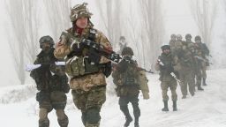 Ukrainian servicemen of the Donbass volunteer battalion take part in clean-up operations in a village in the Lysychansk district of the Lugansk region, controlled by pro-Russian separatists on January 28, 2015.  Ukraine's president appealed to Russia's Vladimir Putin and Washington threatened tougher measures should Moscow fail to rein in separatist fighters mounting a new offensive in the east of the ex-Soviet republic. AFP PHOTO/ ANATOLI BOIKO        (Photo credit should read ANATOLII BOIKO/AFP via Getty Images)
