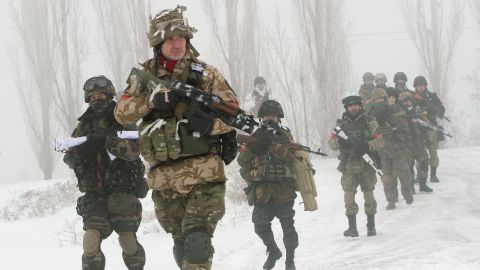 Ukrainian servicemen of the Donbas volunteer battalion take part in clean-up operations in the Lysychansk district of the Luhansk region in January 2015.  