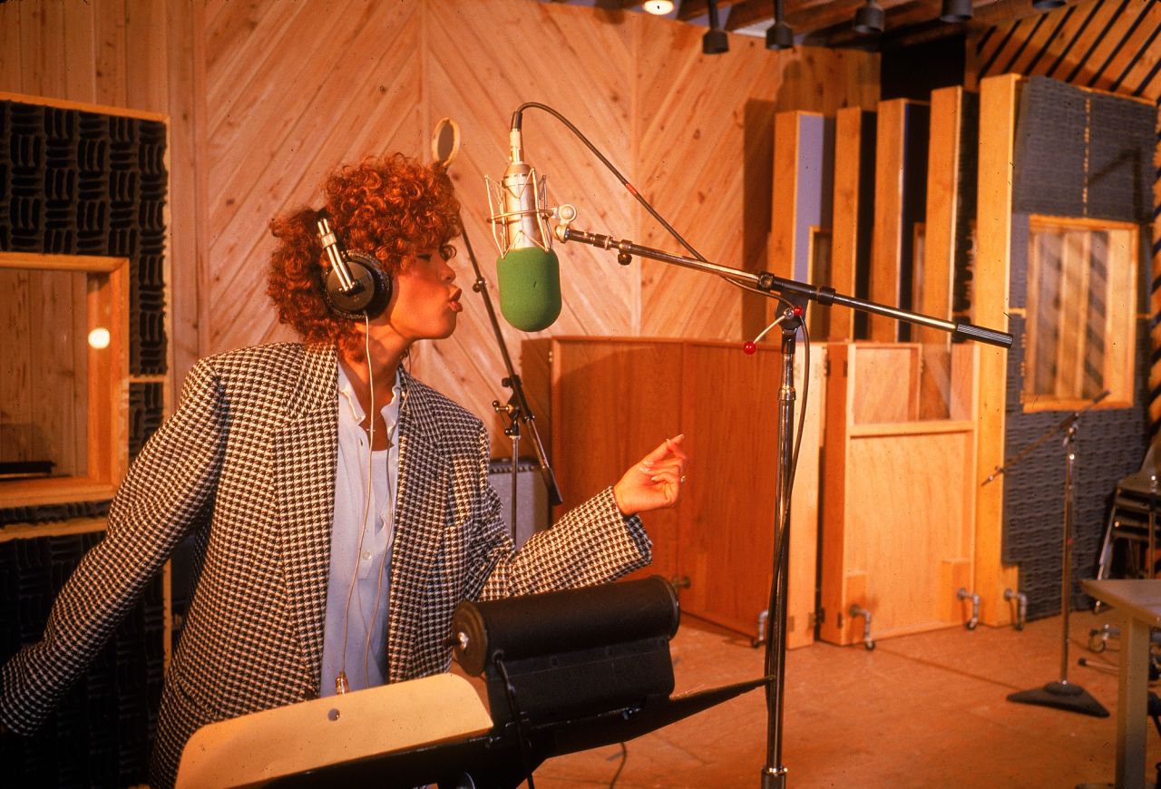 Whitney Houston sings in the recording studio.