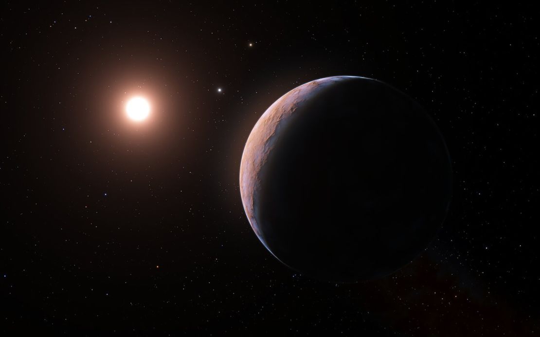 This illustration shows a wider view of Proxima d (right) as it orbits Proxima Centauri (left).