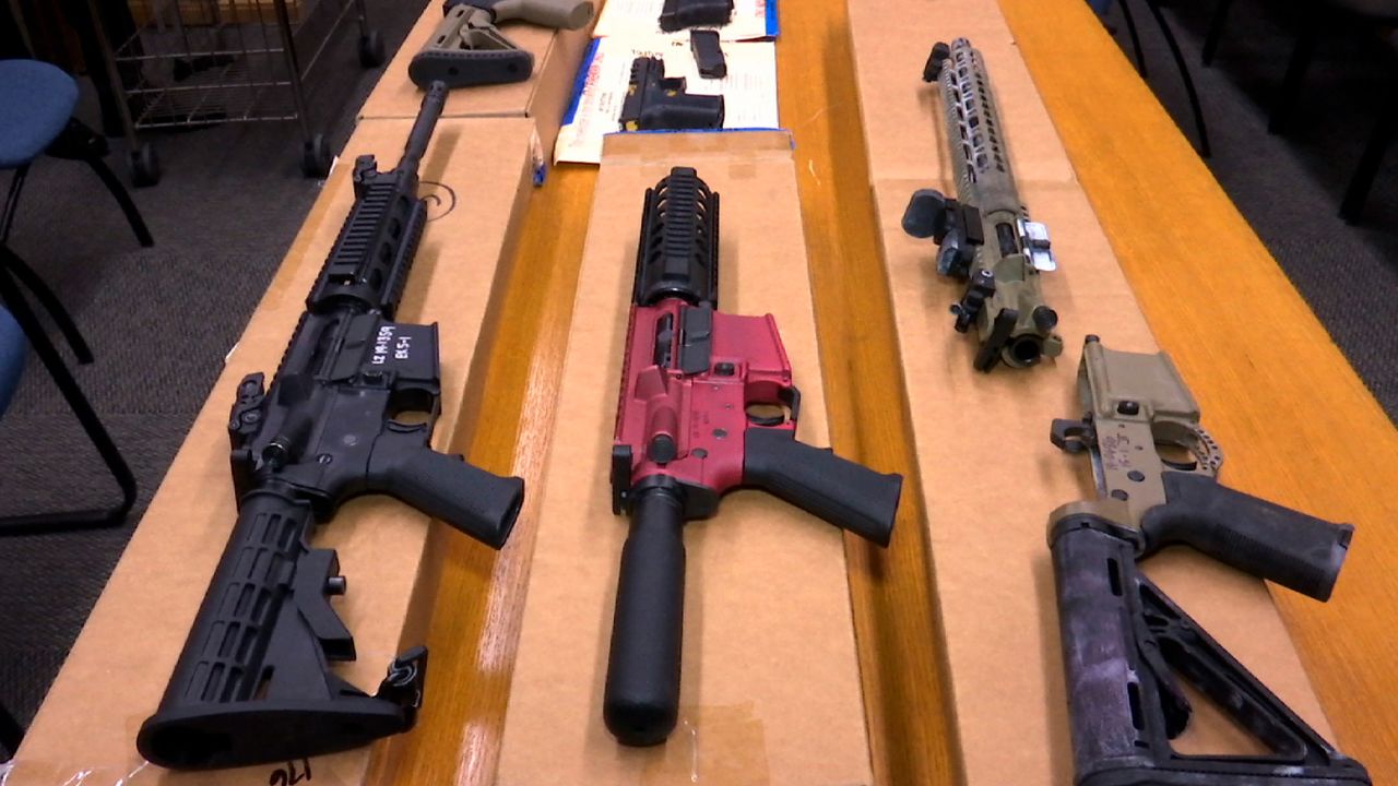 "Ghost guns" are displayed at the headquarters of the San Francisco Police Department in  2019.