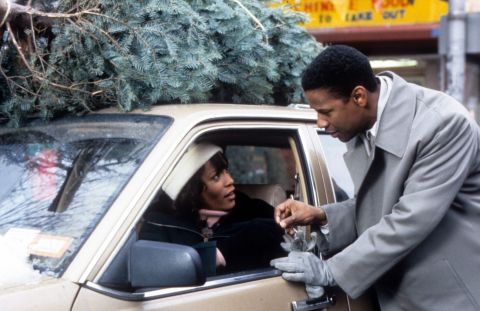 Whitney Houston is approached by Denzel Washington in a scene from the 1996 movie "The Preacher's Wife."