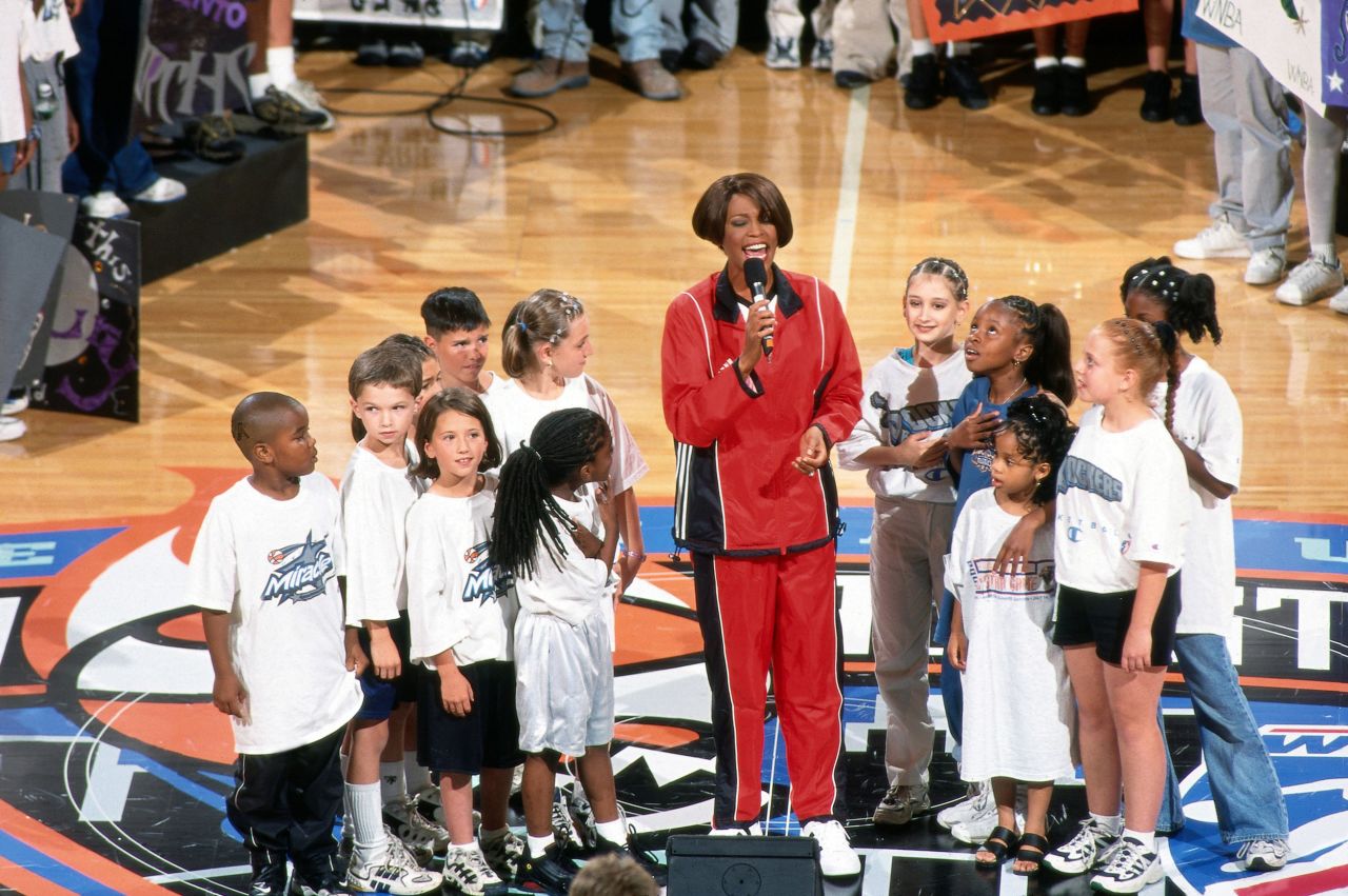Whitney Houston performs the national anthem at the 1999 WNBA All-Star Game, played at Madison Square Garden in New York City on July 14.