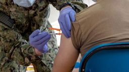 A hospital corpsman administers a Covid-19 vaccine aboard Naval Station Norfolk, on April 8, 2021. The US Navy said Wednesday that it has discharged 240 service members for refusing the vaccine.