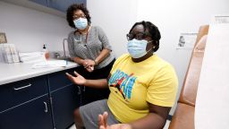 Ella McField, right, talks during an appointment with Dr. Janice Bacon, a primary care physician at Central Mississippi Health Services. (AP Photo/Rogelio V. Solis)