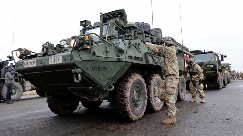 US soldiers prepare armoured combat vehicles before deploying to Romania on February 09, 2022 in Vilseck, Germany -- part of a coordinated deployment of NATO forces across eastern Europe. 