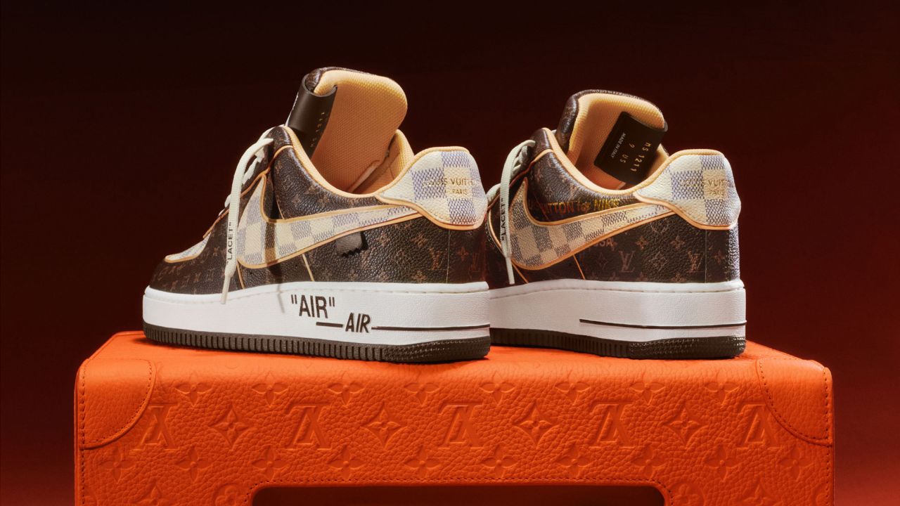 The sneakers are made from calf leather, featuring the Louis Vuitton monogram and pattern alongside the Nike swoosh. The quotation marks on the design are Abloh's 
