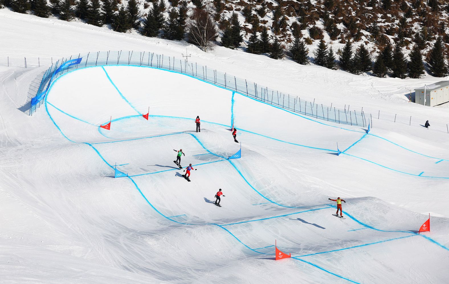 From left, the United States' Nick Baumgartner, Japan's Yoshiki Takahara, the United States' Hagen Kearney and Canada's Kevin Hill compete in a snowboard cross race on February 10.