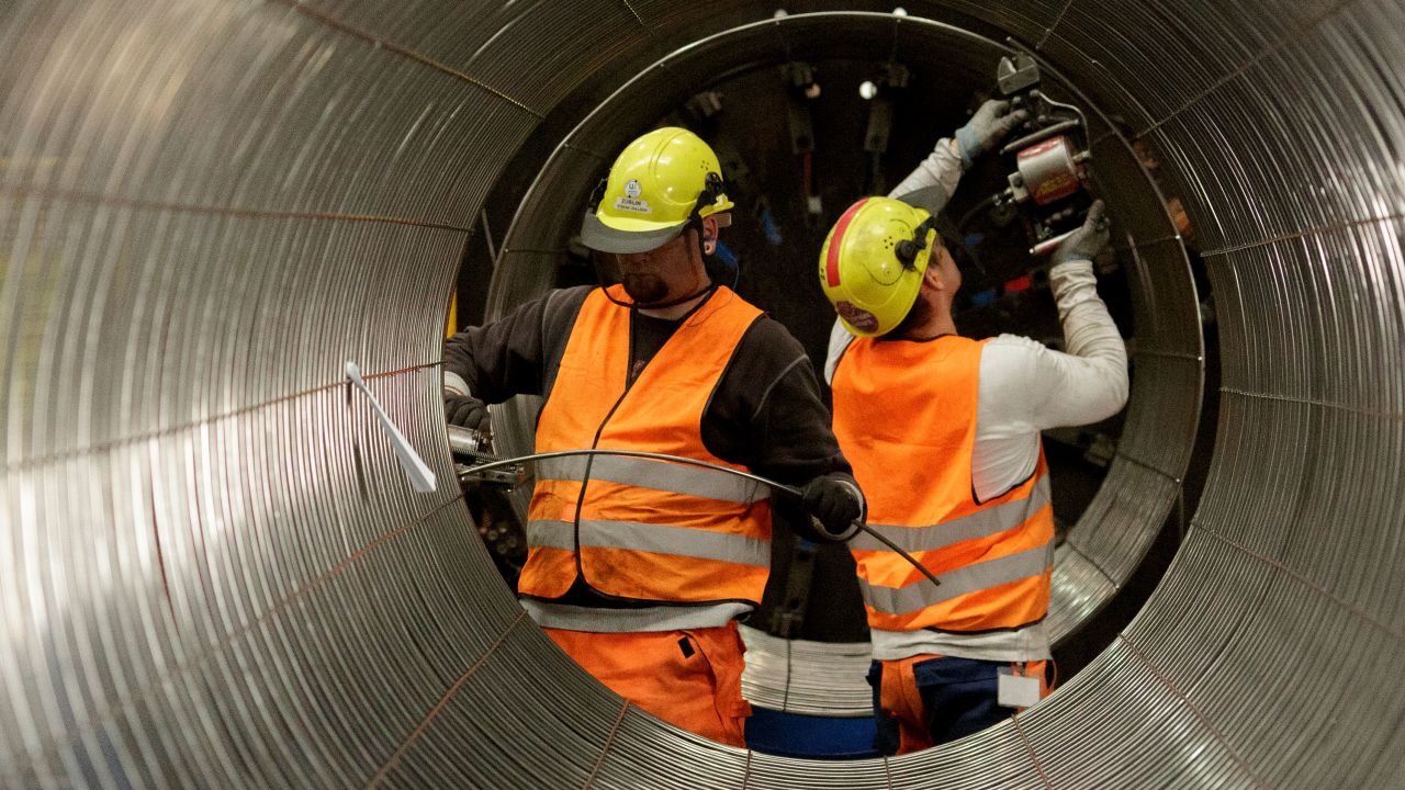 SASSNITZ, GERMANY - OCTOBER 19: Workers are working on an iron cage the production process of pipes in the production hall at the Nord Stream 2 facility at Mukran on Ruegen Islandon October 19, 2017 in Sassnitz, Germany. Nord Stream is laying a second pair of offshore pipelines in the Baltic Sea between Vyborg in Russia and Greifswald in Germany for the transportation of Russian natural gas to western Europe. An initial pair of pipelines was inaugurated in 2012 and the second pair is due for completion by 2019. A total of 50,000 pipes are currently on hand at Mukran, where they receive a concrete wrapping before being transported out to sea. Russian energy supplier Gazprom, whose board is led by former German chancellor Gerhard Schroeder, owns a 51% stake in Nord Stream. (Photo by Carsten Koall/Getty Images)