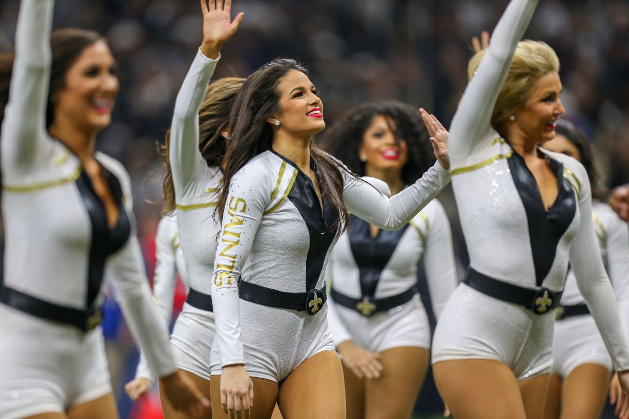 The Saintsations wore jumpsuits in 2019 before going co-ed in 2021 and rebranding to the Saints Cheer Krewe.