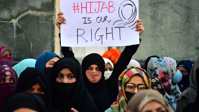 Muslim women hold placards during a protest in Allahabad on February 10, 2022, after educational institutes in Karnataka denied entry to students for wearing hijabs. (Photo by SANJAY KANOJIA / AFP) (Photo by SANJAY KANOJIA/AFP via Getty Images)