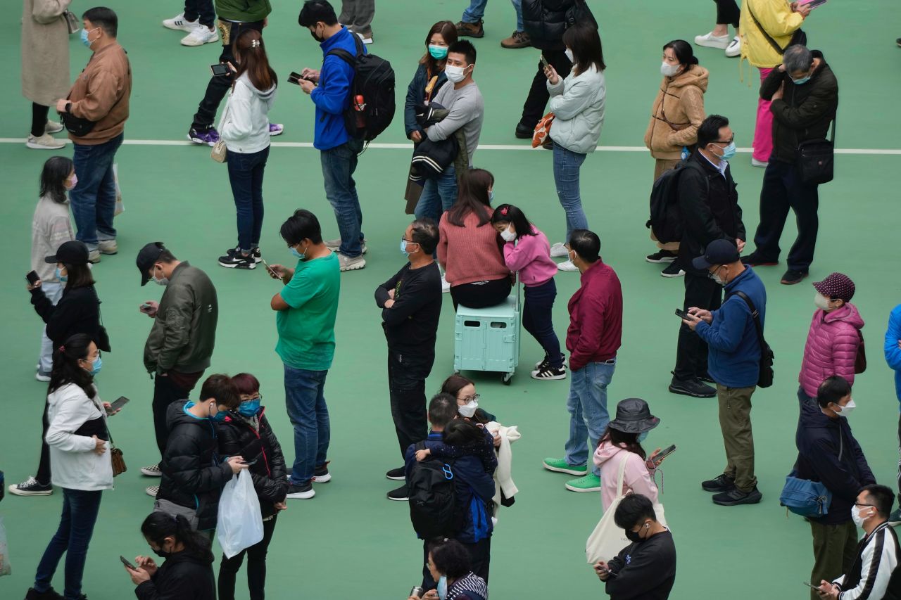 People line up for Covid-19 tests at a temporary testing center in Hong Kong on Wednesday, February 9.
