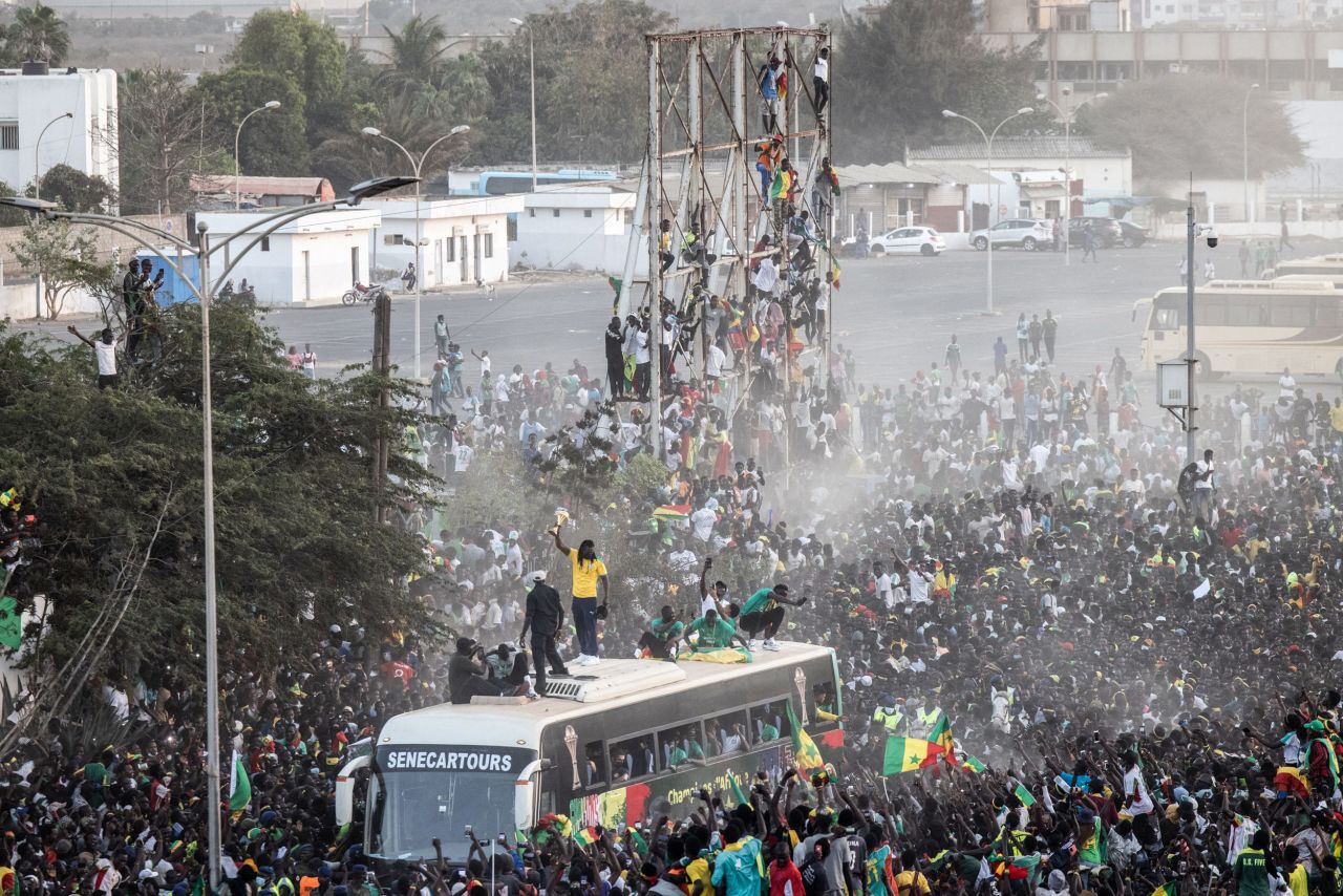 A bus carrying Senegal's soccer team parades through the country's capital of Dakar on Monday, February 7. The team <a href="https://www.cnn.com/2022/02/06/football/senegal-africa-cup-of-nations-egypt/index.html" target="_blank">won the Africa Cup of Nations</a> for the first time in history.