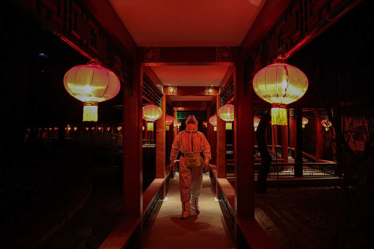 A worker in a hazmat suit walks through a hotel restaurant in Beijing on February 10. The restaurant is part of what authorities have called a <a href="https://www.cnn.com/2022/01/21/china/beijing-winter-olympics-covid-quarantine-explained-mic-intl-hnk/index.html" target="_blank">"closed loop" system</a> — a bubble completely cut off from the rest of the city.