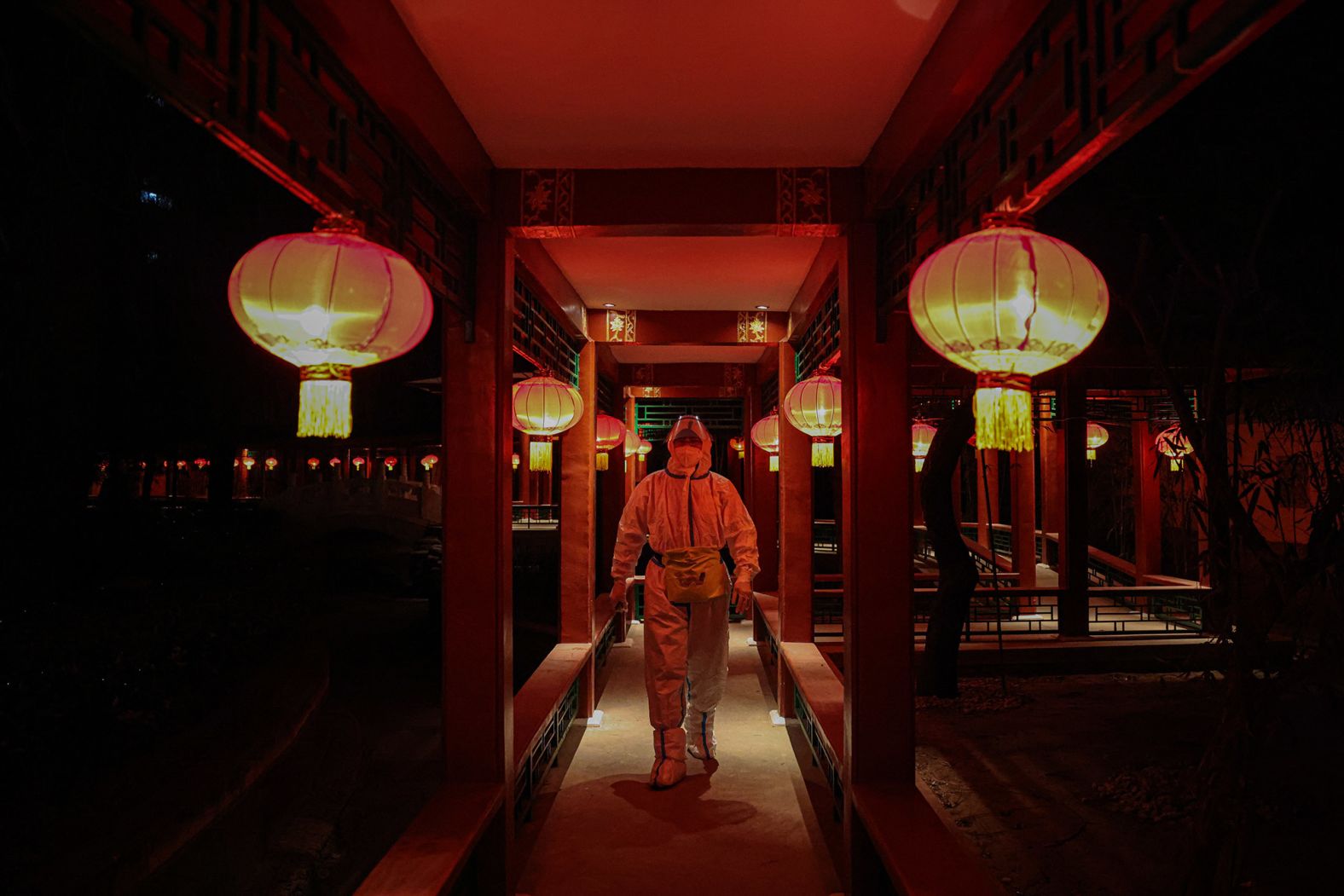 A worker in a hazmat suit walks through a hotel restaurant in Beijing on February 10. The restaurant is part of what authorities have called a <a href="index.php?page=&url=https%3A%2F%2Fwww.cnn.com%2F2022%2F01%2F21%2Fchina%2Fbeijing-winter-olympics-covid-quarantine-explained-mic-intl-hnk%2Findex.html" target="_blank">"closed loop" system</a> — a bubble completely cut off from the rest of the city.