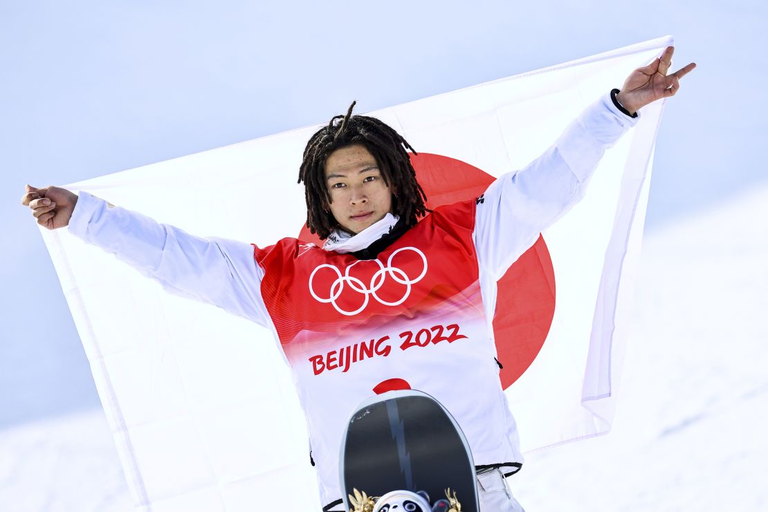 Japan's Ayumu Hirano celebrates after winning gold at the Beijing Games.