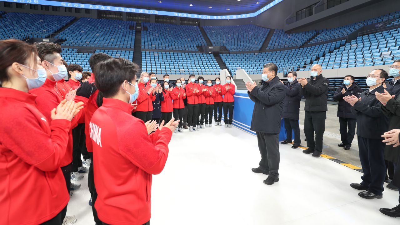 Chinese President Xi Jinping talks with athletes and coaches while visiting the Capital Gymnasium in Haidian District, Beijing in January, 2021.