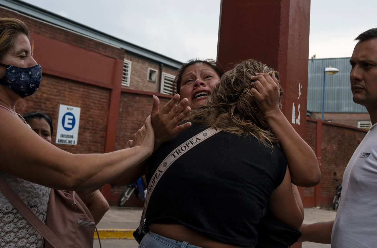 A woman is consoled in a suburb north of Buenos Aires on Friday, February 4, after learning that her brother had died from consuming tainted cocaine. <a href="https://www.cnn.com/2022/02/03/americas/tainted-cocaine-argentina-intl-scli/index.html" target="_blank">At least 20 people died in Argentina</a> after consuming cocaine suspected of containing a poisonous substance, local government officials said. More people were hospitalized.