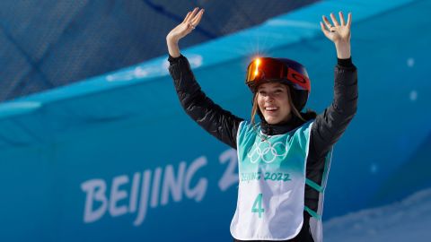 Gold medalist Eileen Gu celebrates on the podium during the freestyle skiing women's big air final during the Beijing 2022 Olympic Winter Games.